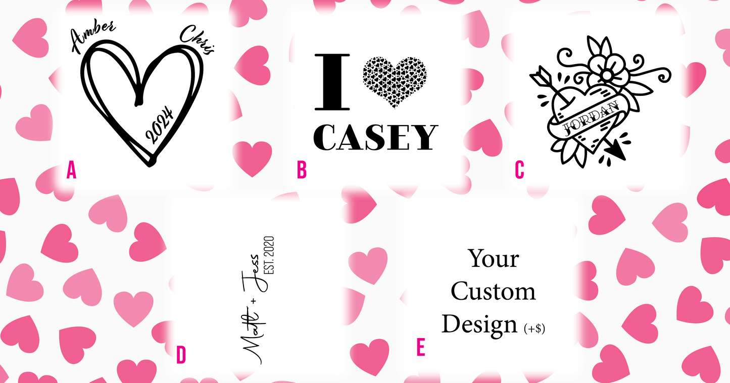 a) HEART WITH YEAR AND NAMES AT TOP LEFT AND RIGHT. B) i (Heart made of hearts) NAME. C) Tattoo Style Heart with arrow, flower and name. D) Name plus name and year established. E) Custom Design, add $10